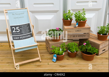25th anniversary deckchair and plants for sale at The Telegraph Hay Festival 2012, Hay-on-Wye, Powys, Wales, UK Stock Photo