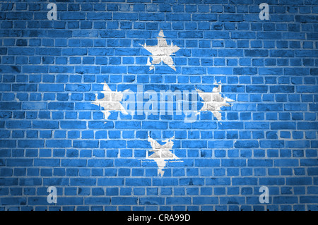 An image of the Micronesia flag painted on a brick wall in an urban location Stock Photo