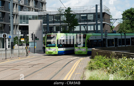 Two Tramlink Trams Pass at East Croydon -1 Stock Photo