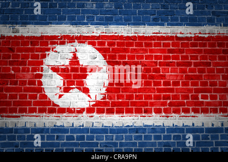 An image of the North Korea flag painted on a brick wall in an urban location Stock Photo