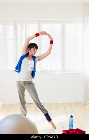 Woman stretching during workout Stock Photo