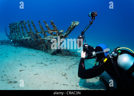 Underwater photographer taking photo of a wooden ship wreck, Makadi Bay, Hurghada, Egypt, Red Sea, Africa Stock Photo