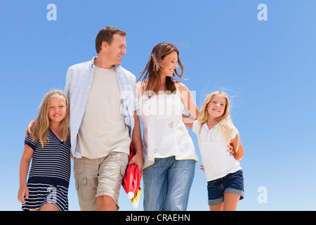 Family walking together outdoors Stock Photo