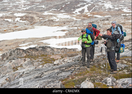 Group of hikers with a guide, at Mittivakkat Glacier, Ammassalik Peninsula, East Greenland, Greenland Stock Photo