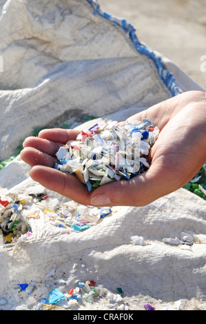 A waste separation site where different recyclable materials are separated and disposed for recycling. Stock Photo