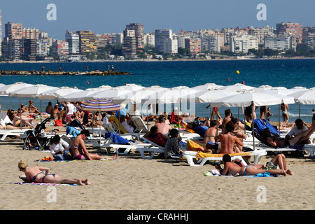 Bathers sunbathing on the beach, Playa del Postiguet, Alicante, Costa Blanca, Spain, Europe Stock Photo