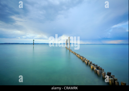 Breakwater on the shore of Guettingen with clouds, Canton Thurgau, Switzerland, Europe Stock Photo