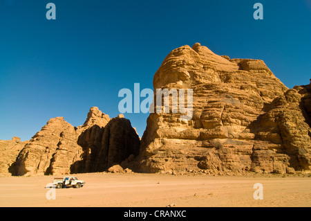 Rocks, an off-road vehicle in front, desert, Wadi Rum, Jordan, Middle East Stock Photo