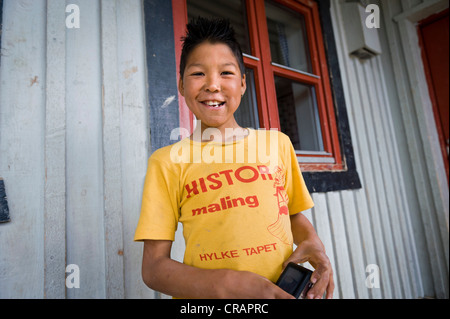 Inuit boy, Inuit settlement of Tiniteqilaaq, Sermilik Fjord, East Greenland, Greenland Stock Photo