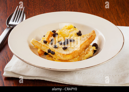 A serving of homely bread and butter pudding. Stock Photo