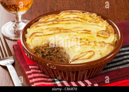 Cottage or Shepherd's Pie with a glass of beer. Stock Photo