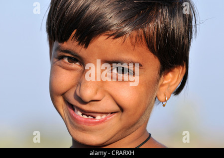 Girl with missing teeth, portrait, Orchha, Madhya Pradesh, northern India, India, Asia Stock Photo