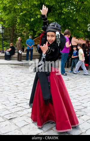 Girl wearing a costume, dancing, Sighnaghi, Kakheti province, Georgia, Caucasus region, Middle East Stock Photo