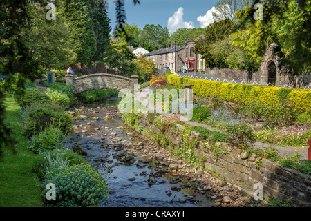 The Coronation gardens in the village of Waddington in Lancashire with the stream that runs through the centre of the village. Stock Photo