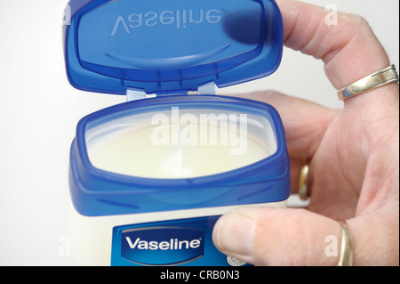 a jar of vaseline with lid open Stock Photo