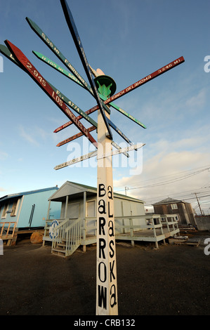 Signpost with distances to cities and other landmarks, Barrow, Alaska, the northernmost city in the US Stock Photo