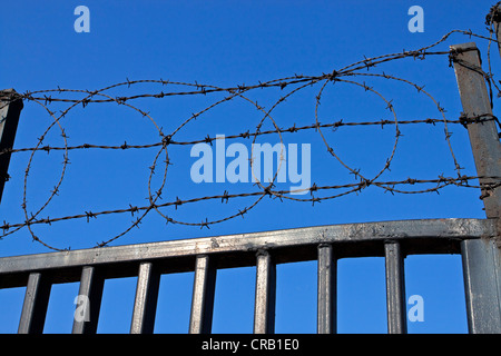 Barb barbed wire security fence fencing gate Stock Photo
