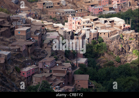 The mosque in the small town of Mzik within the Atlas Mountains of Morocco is illuminated by the sunlight. Stock Photo