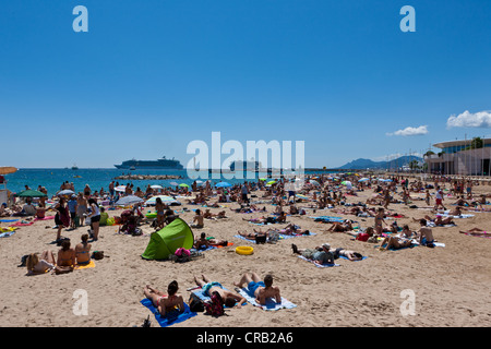 People on the beach of Cannes, at the Croisette, Côte d'Azur, Southern France, Europe, PublicGround Stock Photo