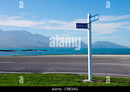 Coastal road with a street sign, Kaikoura Peninsula, South Island, New Zealand Stock Photo