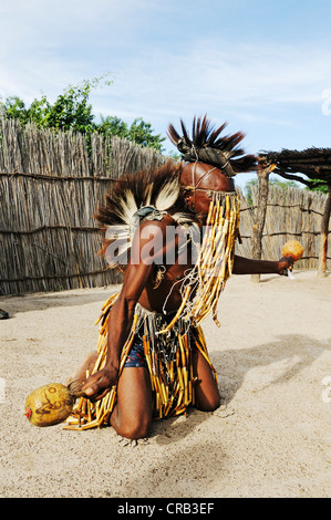 Healer or shaman dancing as a show for tourists, traditional village near Camp Kwando on the Kwando River Stock Photo