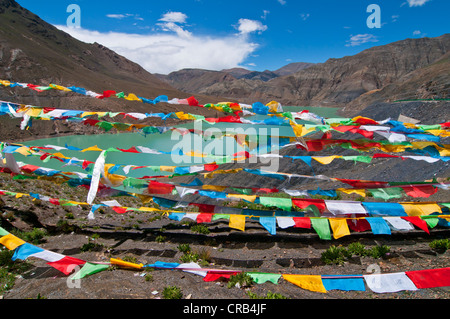 Prayer flags at a reservoir on the Karo-La Pass on the Friendship Highway, Tibet, Asia Stock Photo