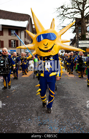 Drum major of a Guggenmusik group, carnival marching band, dressed as the sun, 35th Motteri parade in Malters, Lucerne Stock Photo