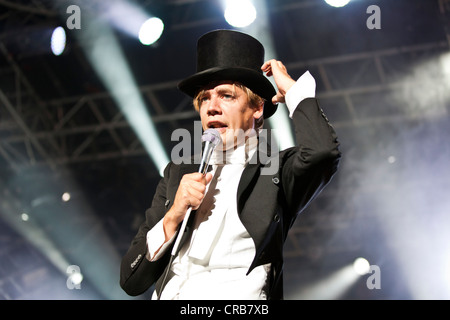 Howlin 'Pelle Almqvist, singer and front man of the Swedish band The Hives performing live at the Heitere Open Air festival in Stock Photo