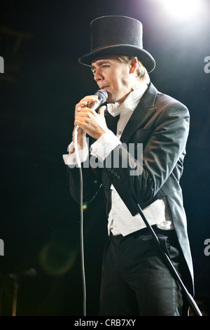 Howlin 'Pelle Almqvist, singer and front man of the Swedish band The Hives performing live at the Heitere Open Air festival in Stock Photo