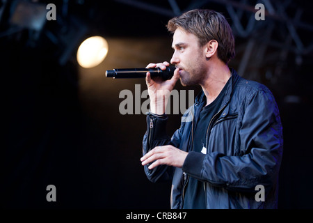 German songwriter and rapper Thomas Huebner aka Clueso performing live at the Heitere Open Air music festival in Zofingen Stock Photo