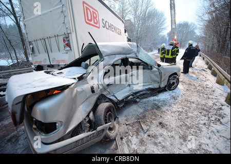 Fatal car accident on the slippery snow of an icy road, an E-Class Mercedes was hurled onto the opposite carriageway and Stock Photo