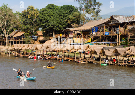 Tourists kayaking in the Water Fun Park on Nam Song River, Vang Vieng, Vientiane, Laos, Indochina, Asia Stock Photo