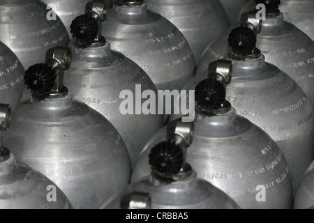Scuba tanks, oxygen bottles for diving under pressure, compressed gas cylinders Stock Photo