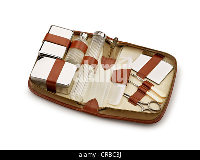 Opened beauty toilet Kit for travel on white background Stock Photo