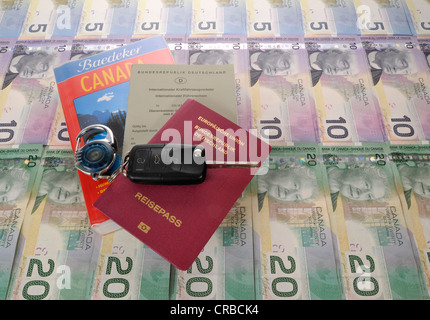 Ignition key, international driving license, passport of the Federal Republic of Germany, guide book for Canada and various Stock Photo