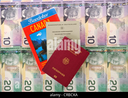 International driving license, passport of the Federal Republic of Germany, guide book for Canada, various Canadian dollar Stock Photo