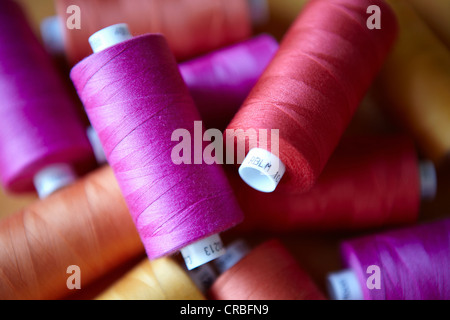 Close up of colorful spools of thread Stock Photo