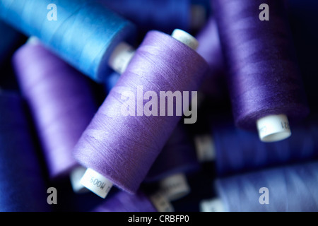 Close up of blue spools of thread Stock Photo