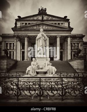 Black and white image, sepia-toned, statue of Friedrich Schiller in front of the Konzerthaus concert hall, designed by Karl Stock Photo