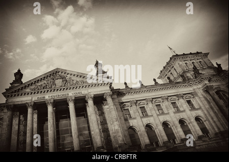 Black and white image, sepia-toned, Reichstag Building, German Parliament, with the inscription, Dem Deutschen Volke, German for