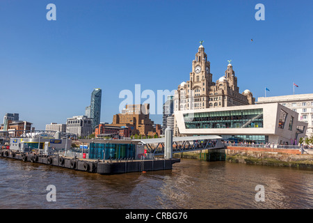 Liverpool pierhead waterfront with landing stage and Liver building. Stock Photo