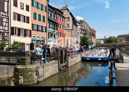 Tourist boat travelling through a lock on the Ill River, Petite France, Strasbourg, Alsace, France, Europe Stock Photo