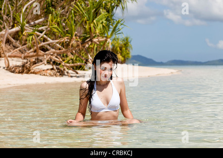 Young, pretty Asian woman in a bikini at an idyllic beach on Pandan Island in Honda Bay, , Palawan Island, Philippines, Asia Stock Photo