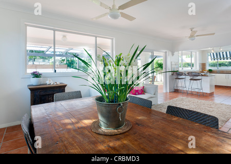Dining area and kitchen in stylish Australian home Stock Photo