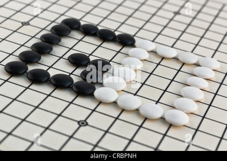 Traditional Chinese, Japanese, Korean Board Game - Go (Weigi - Igo - Baduk - Encircling Game) Stock Photo