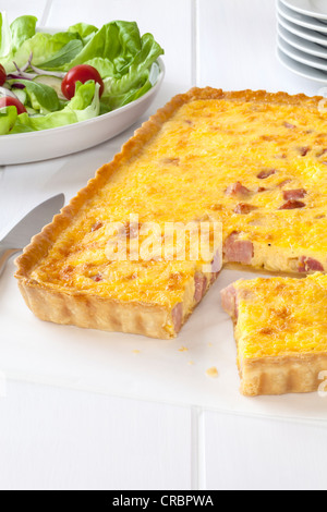 French classic, homemade Quiche Lorraine with salad Stock Photo