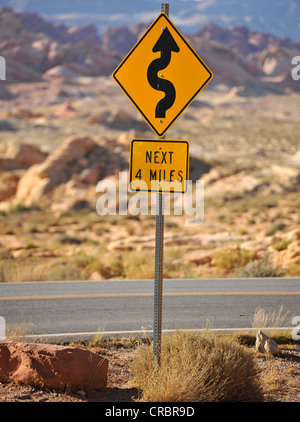 Windy road sign Stock Photo - Alamy