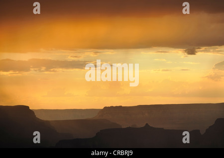 Thunderstorm and rain showers, view at sunset from Yavapai Point lookout towards Isis Temple, Bright Angel Canyon Stock Photo