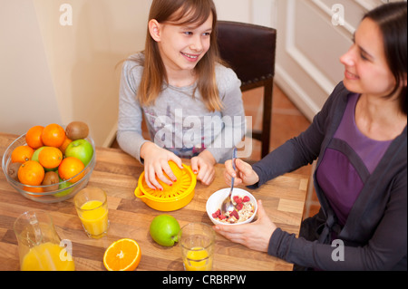 Mother and daughter having breakfast Stock Photo