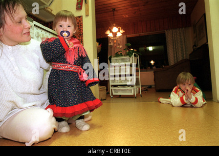 Sámi woman and her children (Finnish Lapland) Stock Photo